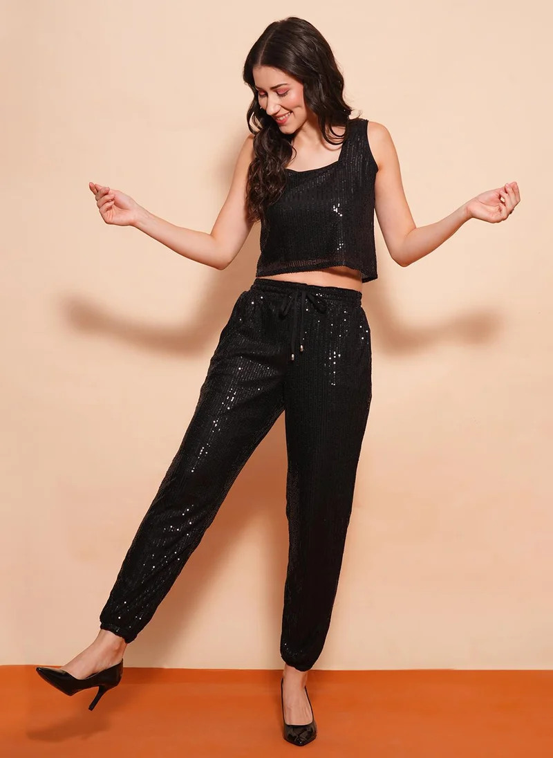 جلو باص طقم نسائي بلوزة مزينة مع بنطلون